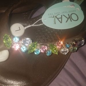 Oka b flip flops with gemstone embellishments.